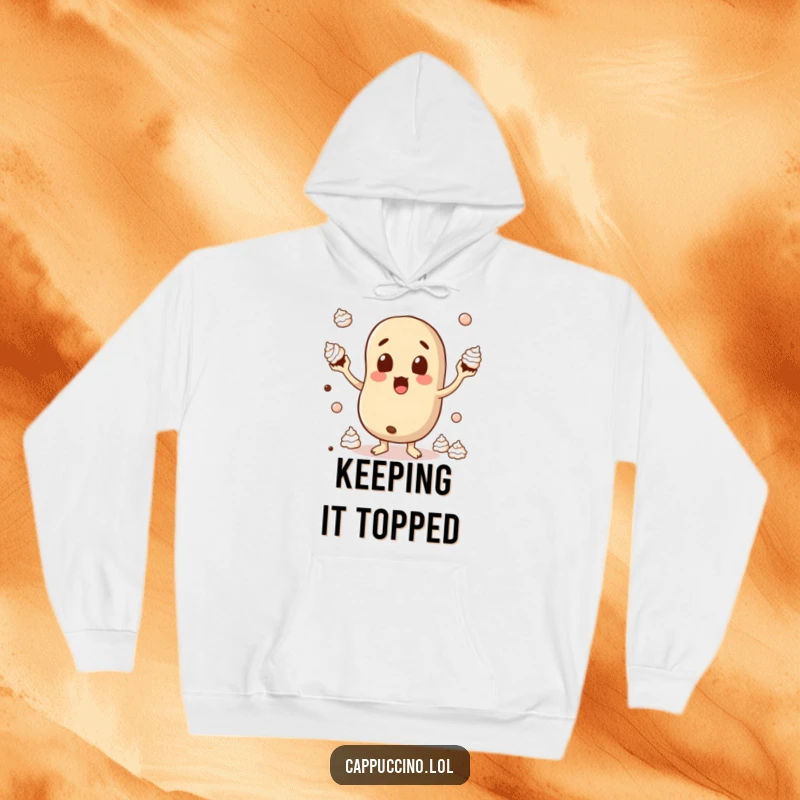Funny Hoodie featuring a wide-eyed coffee bean character comically juggling dollops of whipped cream, offering cozy humor.